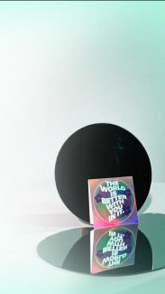 Background image; a stack of Society of Valued Minds stickers that say "THE WORLD IS BETTER WITH YOU IN IT" lean against a reflective mirror.